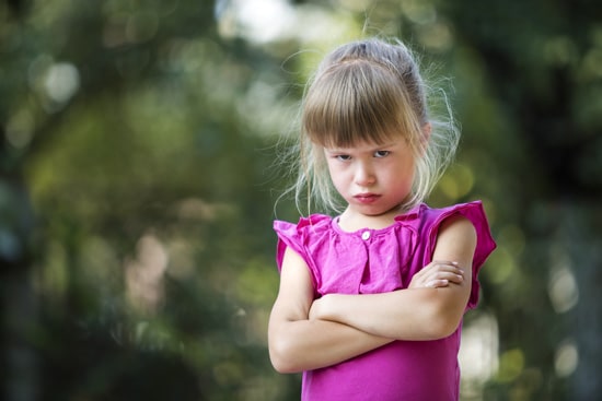 angry girl with crossed arms